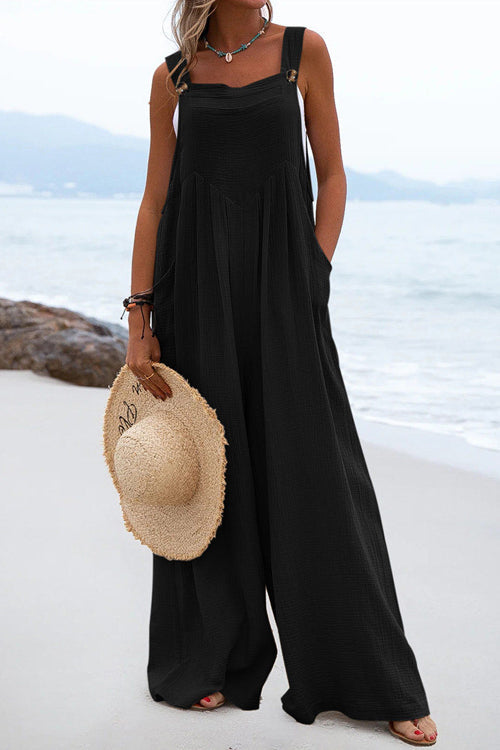 Chique Overall mit breiten Hosenbeinen und Knopfdetails