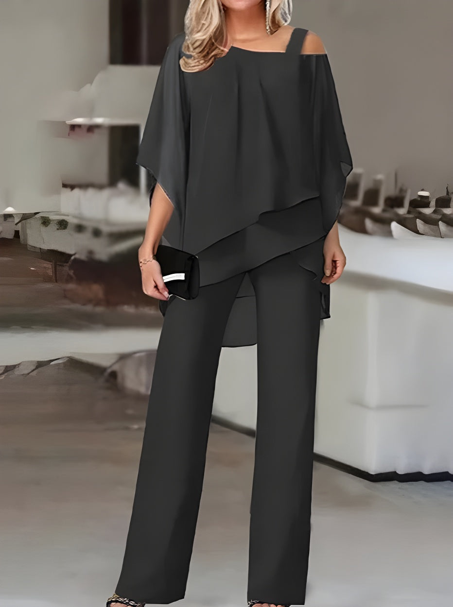 Luxuriöses, asymmetrisches Set aus schulterfreier Bluse und Hose
