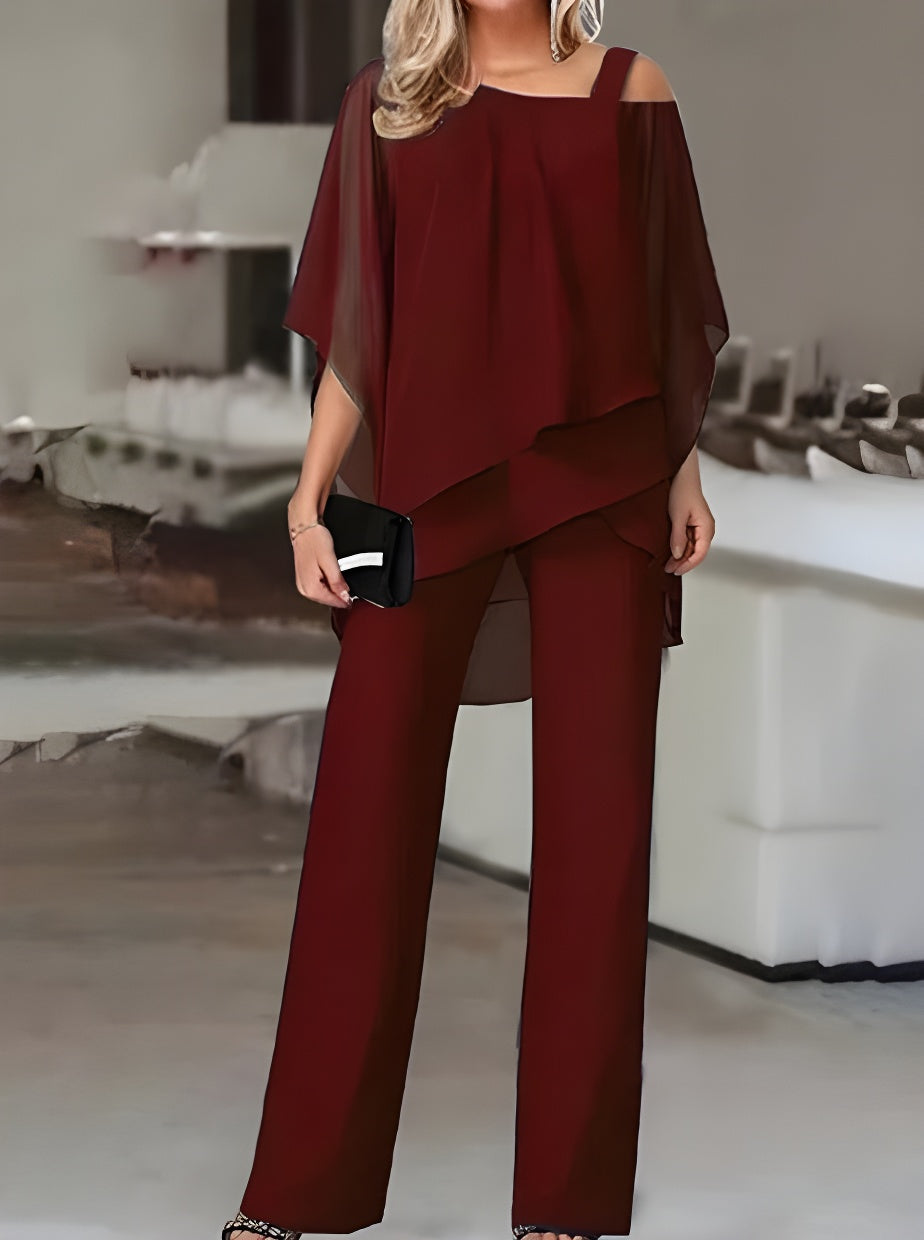 Luxuriöses, asymmetrisches Set aus schulterfreier Bluse und Hose