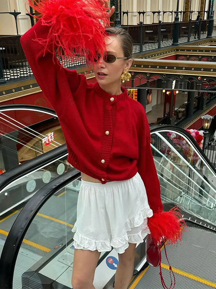 Mei | Roter patchwork-strick-cardigan mit federdetails